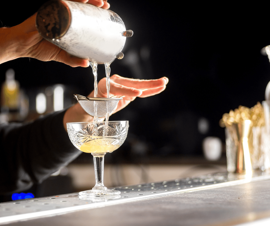 cocktail-poured-over-strainer